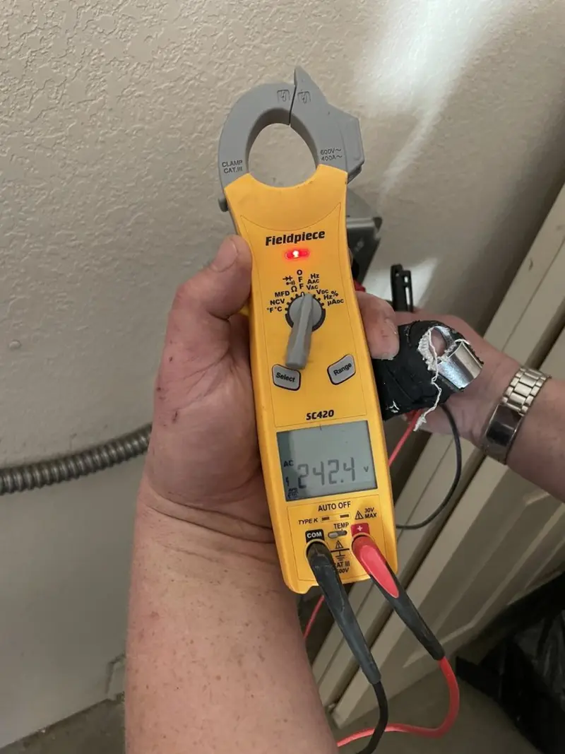 Voltage testing with clamp meter during Electrical Installation Services in Mountain Green